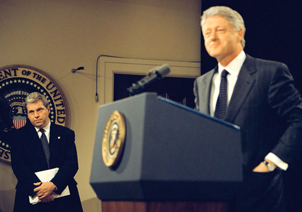 Lockhart, as Clinton speaks at a press conference in 1999.