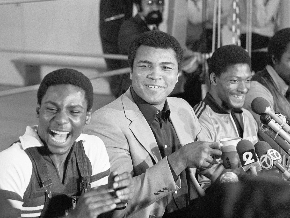 Muhammad Ali bought a one-story brick home for Houston McTear (right) and his family in 1976.