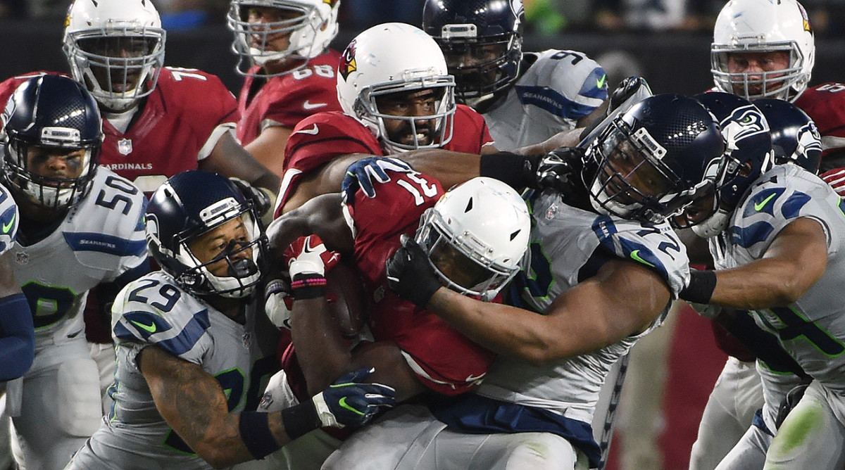 Arizona Cardinals receiver Bryant Johnson (80) is pulled down by San  Francisco 49ers Mike Adams (20) during the first quarter of NFL football  action Sunday, Sept. 10, 2006 at Cardinals Stadium in