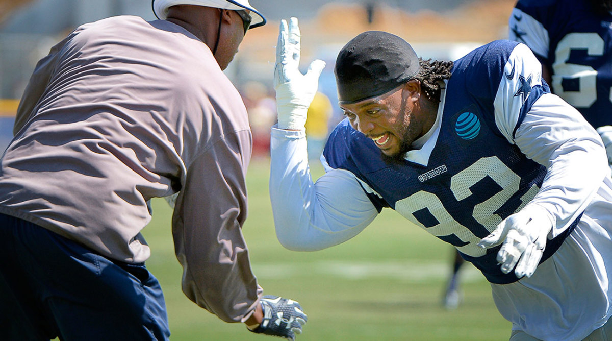 Newcomer Cedric Thornton runs through drills with Leon Lett.  