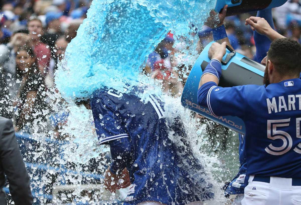 2015-0607-Chris-Colabello-doused-by-Russell-Martin-Kevin-Pillar.jpg