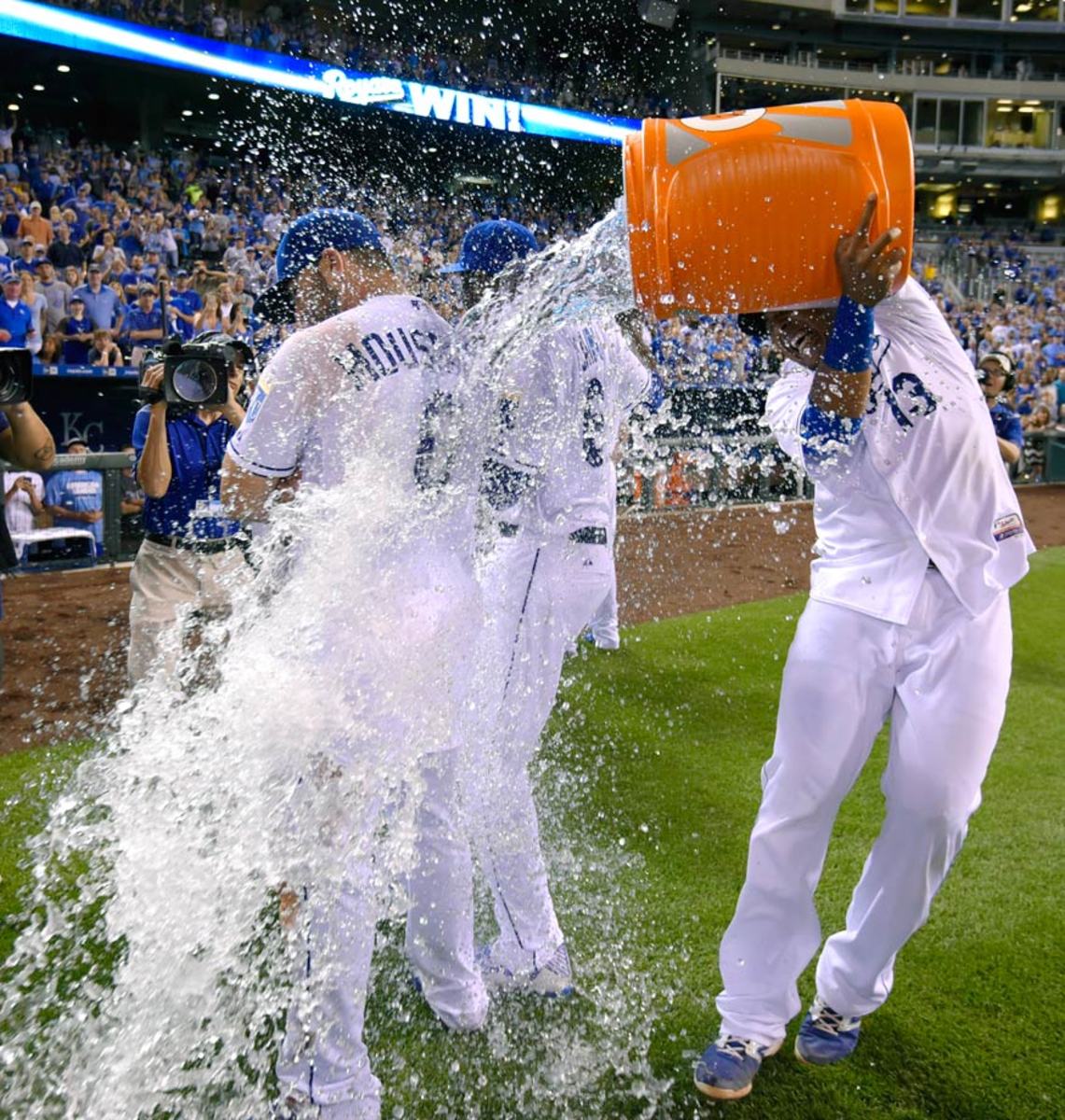 2015-0515-Mike-Moustakas-Lorenzo-Cain-doused-by-Salvador-Perez.jpg