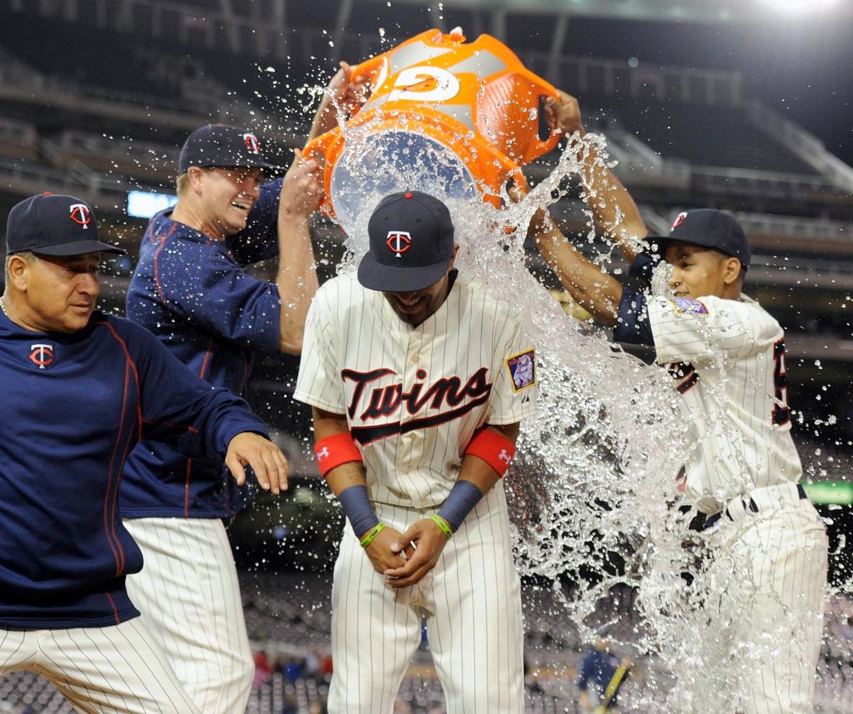 2015-0506-Eddie-Rosario-doused-by-Kyle-Gibson-batboy.jpg