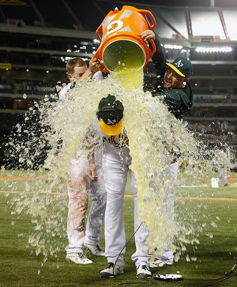 2015-0722-Ike-Davis-doused-by-Stephen-Vogt-Billy-Butler.jpg