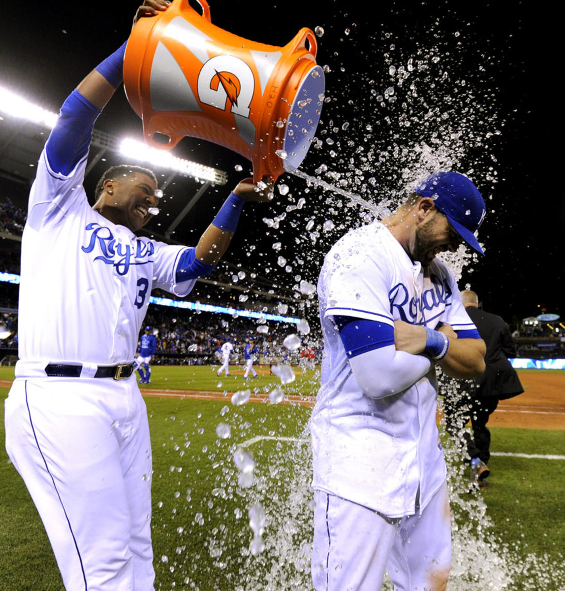 2015-0519-Mike-Moustakas-doused-by-Salvador-Perez.jpg