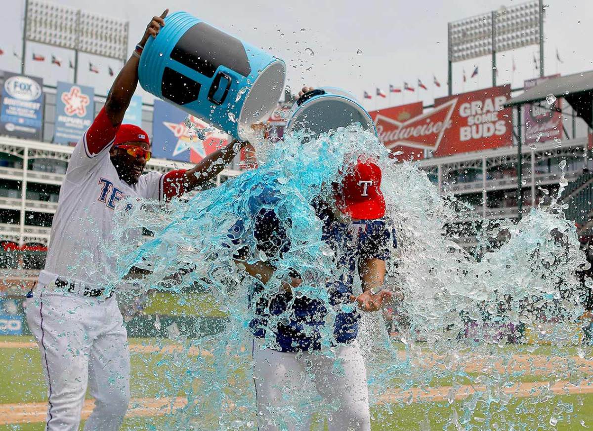 2015-0819-Derek-Holland-doused-by-Hanser-Alberto-Rougned-Odor.jpg