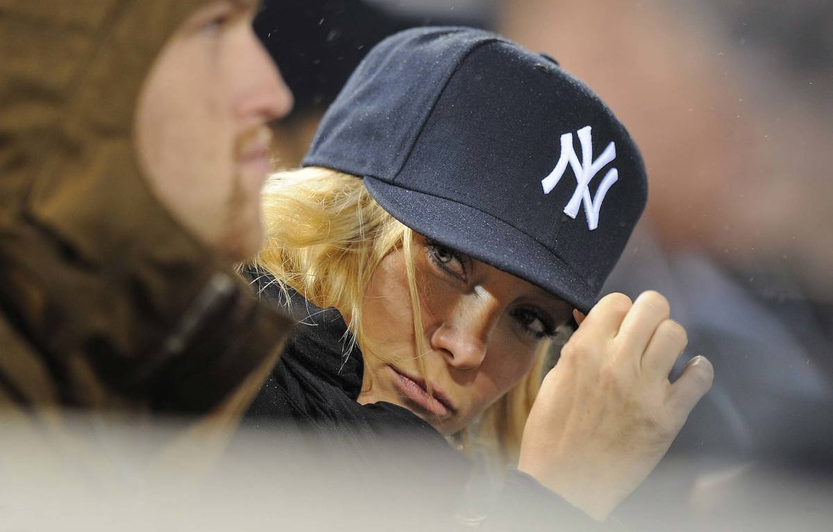 portrait of jay - z wearing a yankee baseball hat and