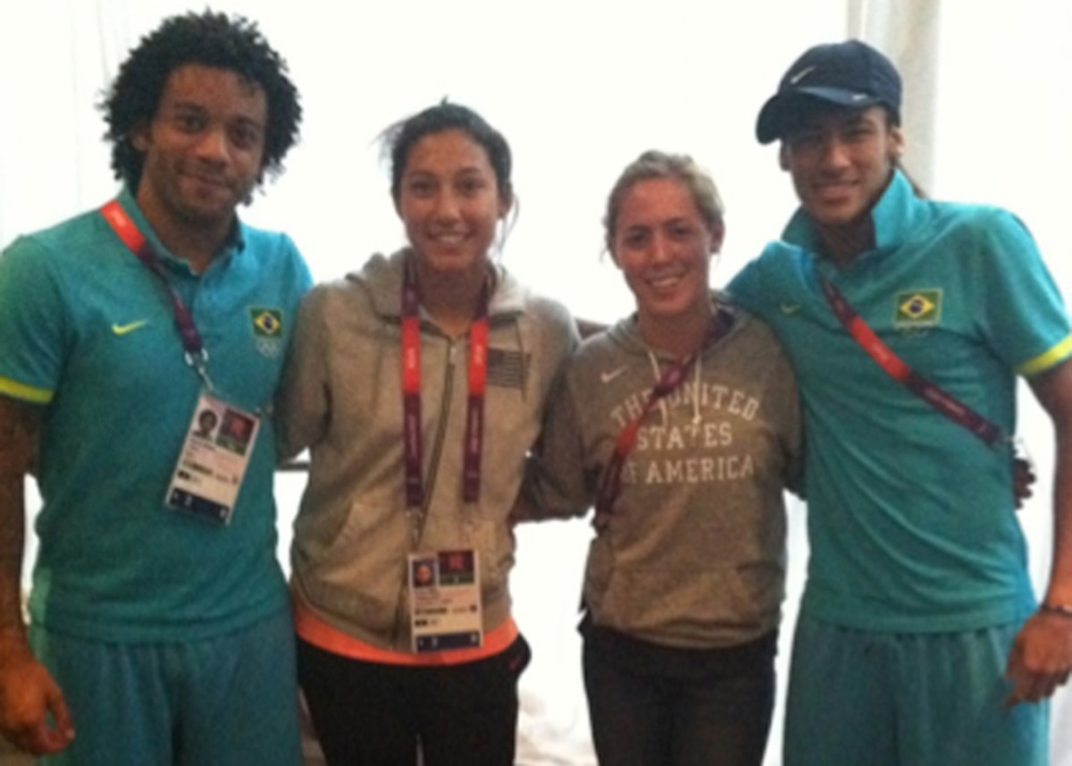 Brazil's Marcelo, Neymar pose with the USA's Christen Press, Meghan Klingenberg at the 2012 Olympics in London.