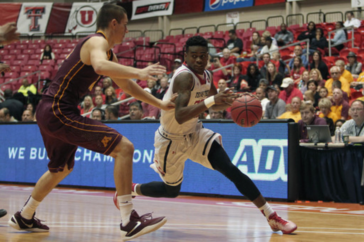 Texas Tech guard Jordan Jackson, right, dribbles against Minnesota forward Joey King during the Puerto Rico Tip-Off college basketball tournament in San Juan, Sunday, Nov. 22, 2015. (AP Photo/Ricardo Arduengo)