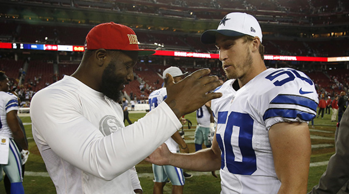 Fellow Penn Staters NaVorro Bowman and Sean Lee chat on the field after Cowboys at 49ers preseason game in Santa Clara Aug. 23. (AP Photo/Tony Avelar)