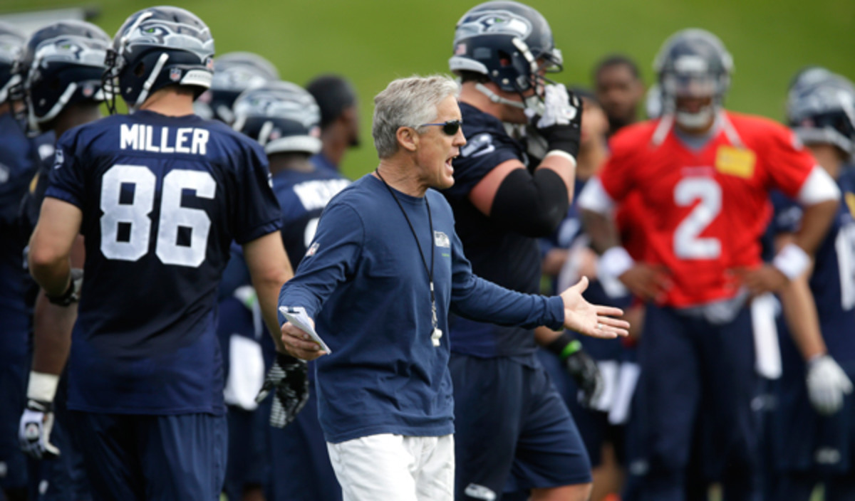 Pete Carroll's Seahawks hit the field for the first time since Super Bowl XLVIII. (Ted S. Warren/AP)