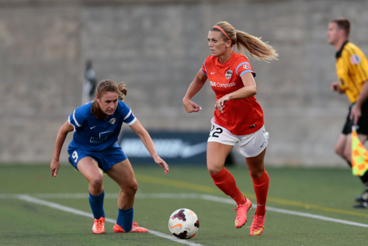 Boston Breakers and veteran U.S. women's national team star Heather O'Reilly challenges the Houston Dash's Stephanie Ochs in NWSL action last weekend.