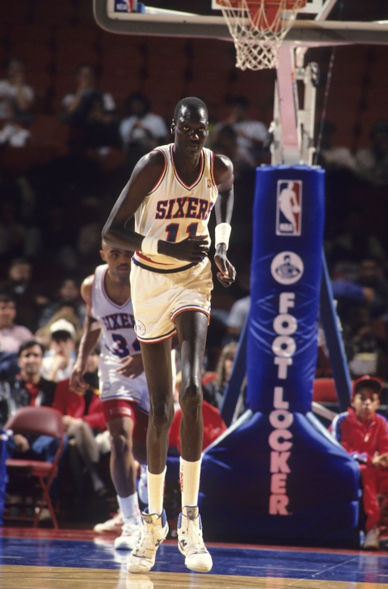 Professional basketball player Manute Bol, with the Philadelphia