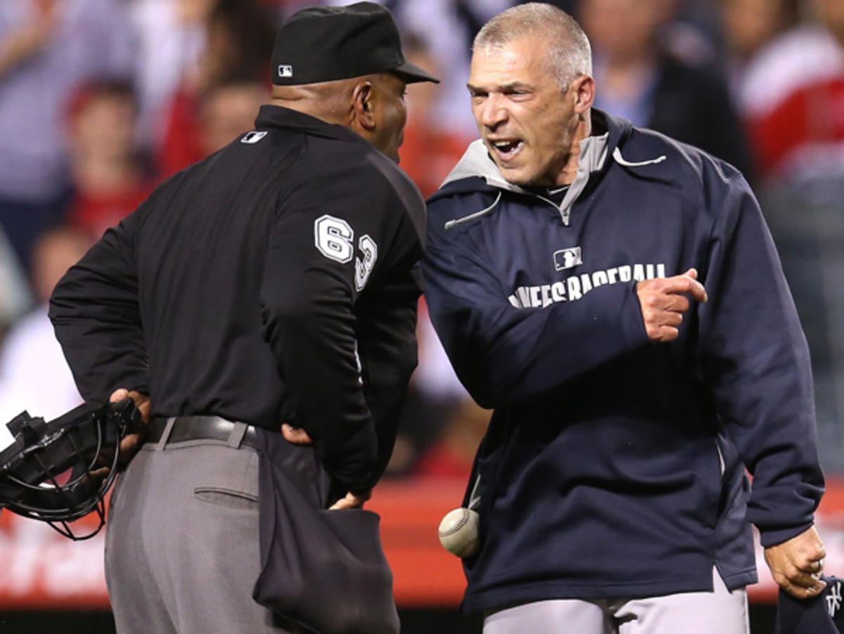 Laz Diaz and Joe Girardi had some words for each other during Monday's Angels-Yankees game. (Stephen Dunn/Getty Images)