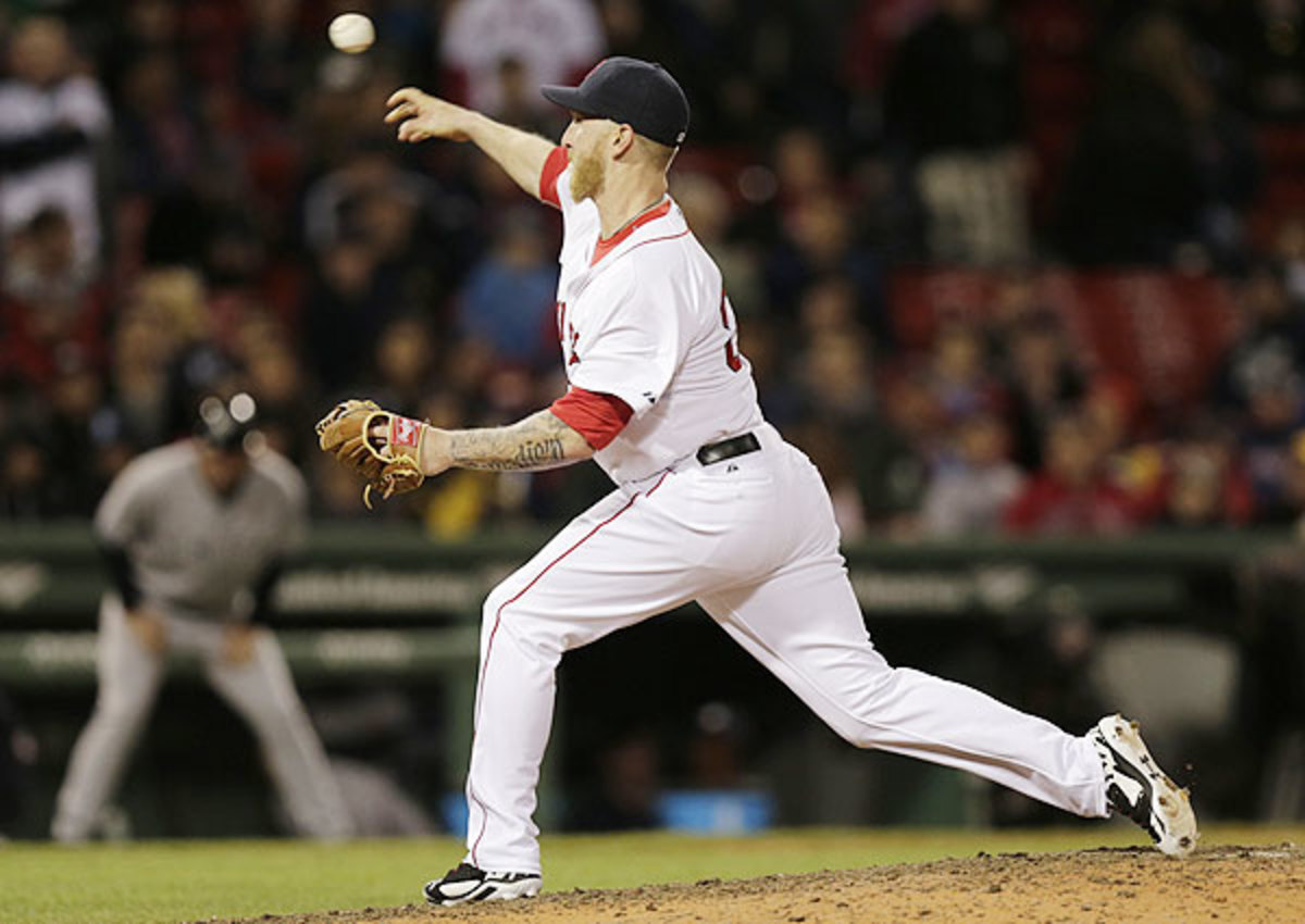 Outfielder Mike Carp walks the ballpark in relief during Red Sox loss