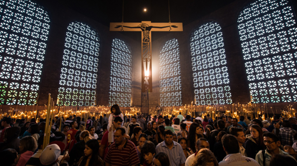 Faithful observers light candles at the National Shrine of Our Lady Aparecida.