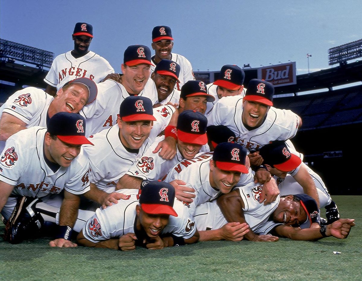 11 May. 1995: California Angels hitting coach Rod Carew (29) posing for  photographs for team photographer V.J. Lovero before a game against the  Texas Rangers played at Angel Stadium of Anaheim in