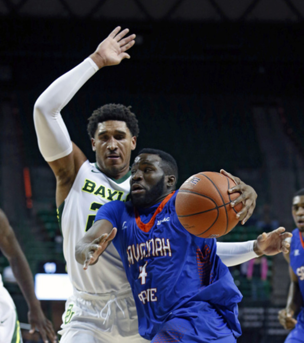 Savannah State guard Troyce Manassa (4) drives on Baylor guard Ishmail Wainright (24), left, during the first half of an NCAA college basketball game, Monday, Nov. 23, 2015, in Waco, Texas. (Jose Yau/Waco Tribune Herald, via AP) MANDATORY CREDIT