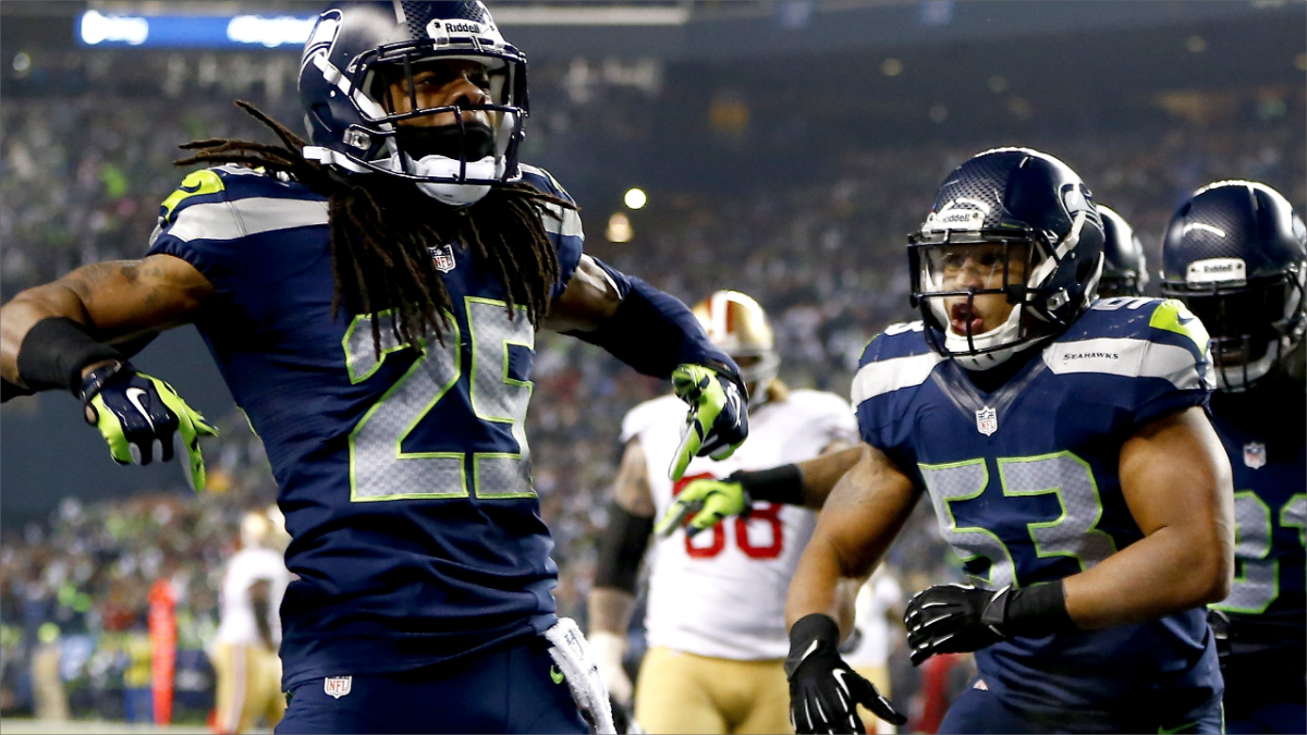 Seattle Seahawks head coach Pete Carroll talks things over with cornerback  Richard Sherman (25) while on the sidelines during the Super Bowl XLVIII at  MetLife Stadium in East Rutherford, New Jersey on