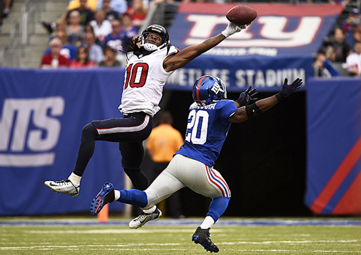 DeAndre Hopkins' 49-yard catch (yes, he held on) against the Giants last September was the catch of the year until Odell Beckham came along. (Alex Goodlett/Getty Images)