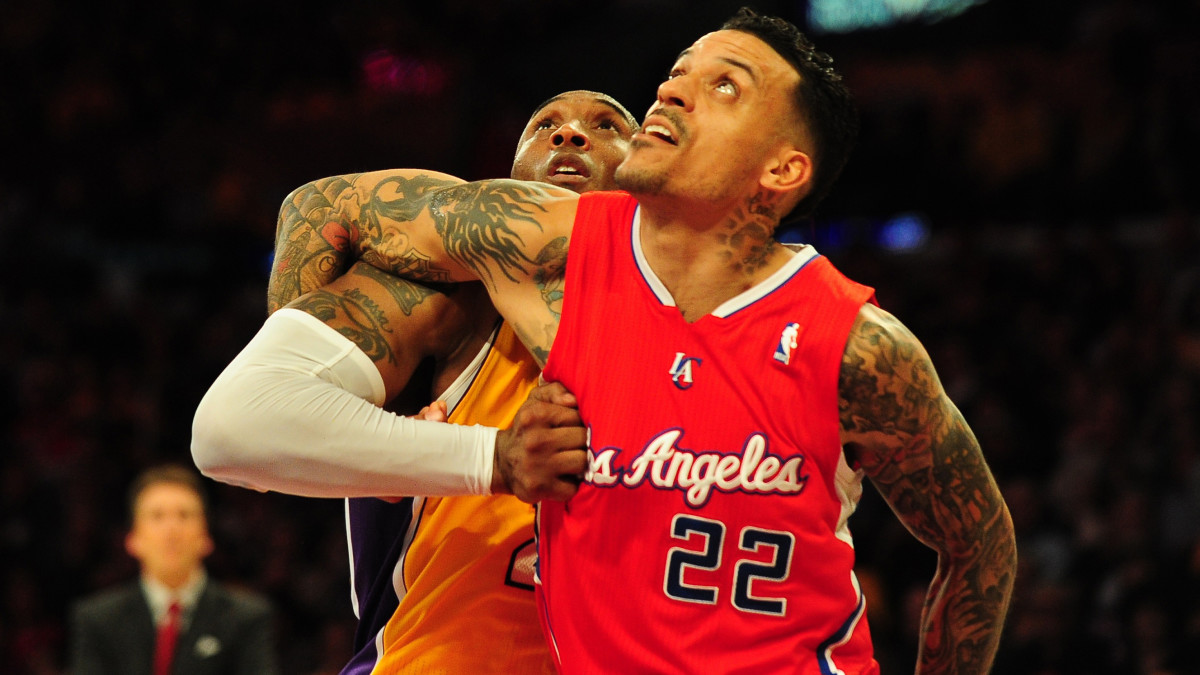 Kobe Bryant in Hollywood Nights Jersey sizes up Matt Barnes.JPG