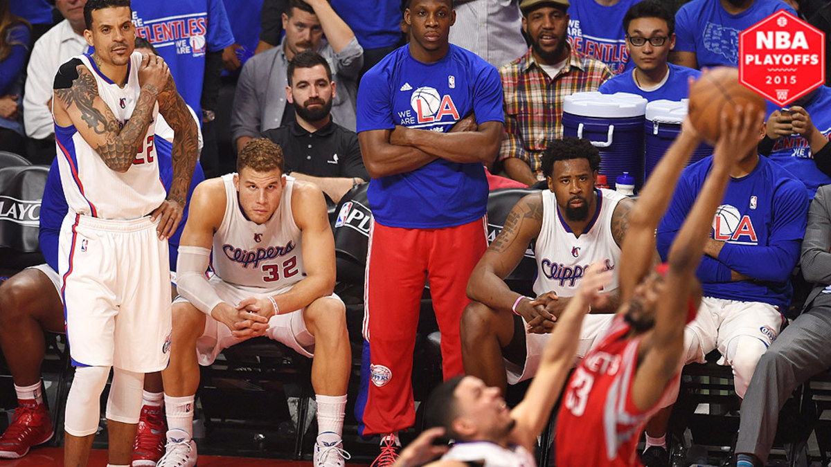 Blake Griffin hands on his waist in a Clippers red jersey