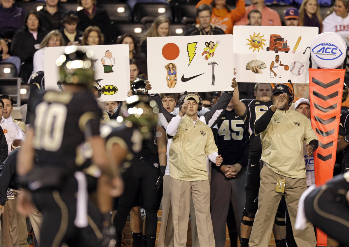 funny-photo-boards-used-to-call-signals-from-sideline-sports-illustrated