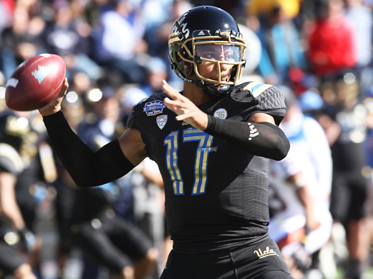 Considered a possible first-round pick once he enters the NFL draft, Brett Hundley will hone his skills for one more season at UCLA. (Victor Calzada/AP)