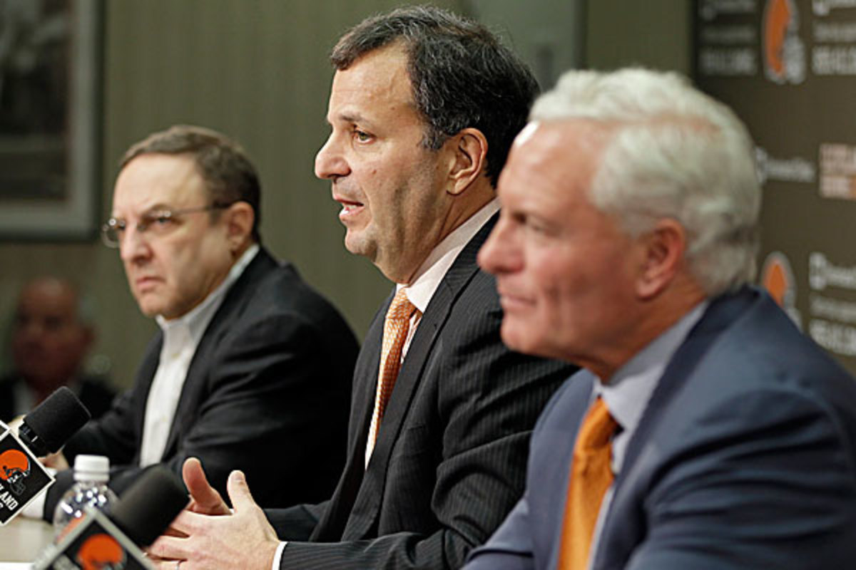 A little less than 13 months after this picture was taken, Joe Banner (left) and Mike Lombardi (center) are out in Cleveland. (Mark Duncan/AP)