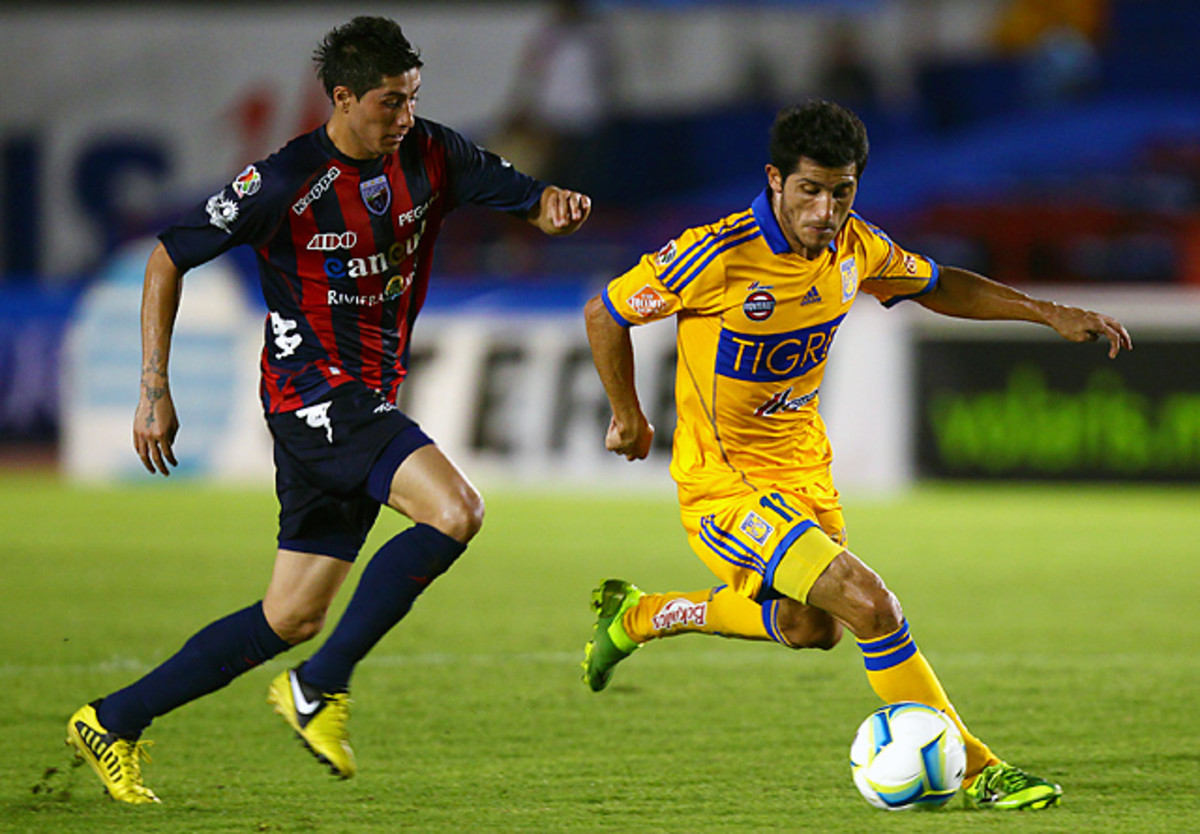 Damian Alvarez (right) scored in the 11th minute to help Tigres get past Atlante on Sunday.