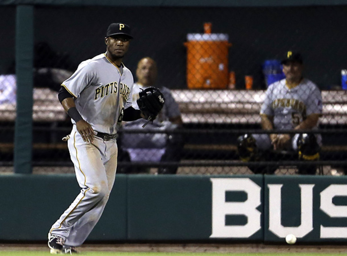 Starling Marte reacts after dropping the fly ball that helped the Cardinals back into Tuesday's game. [Jeff Roberson/AP]