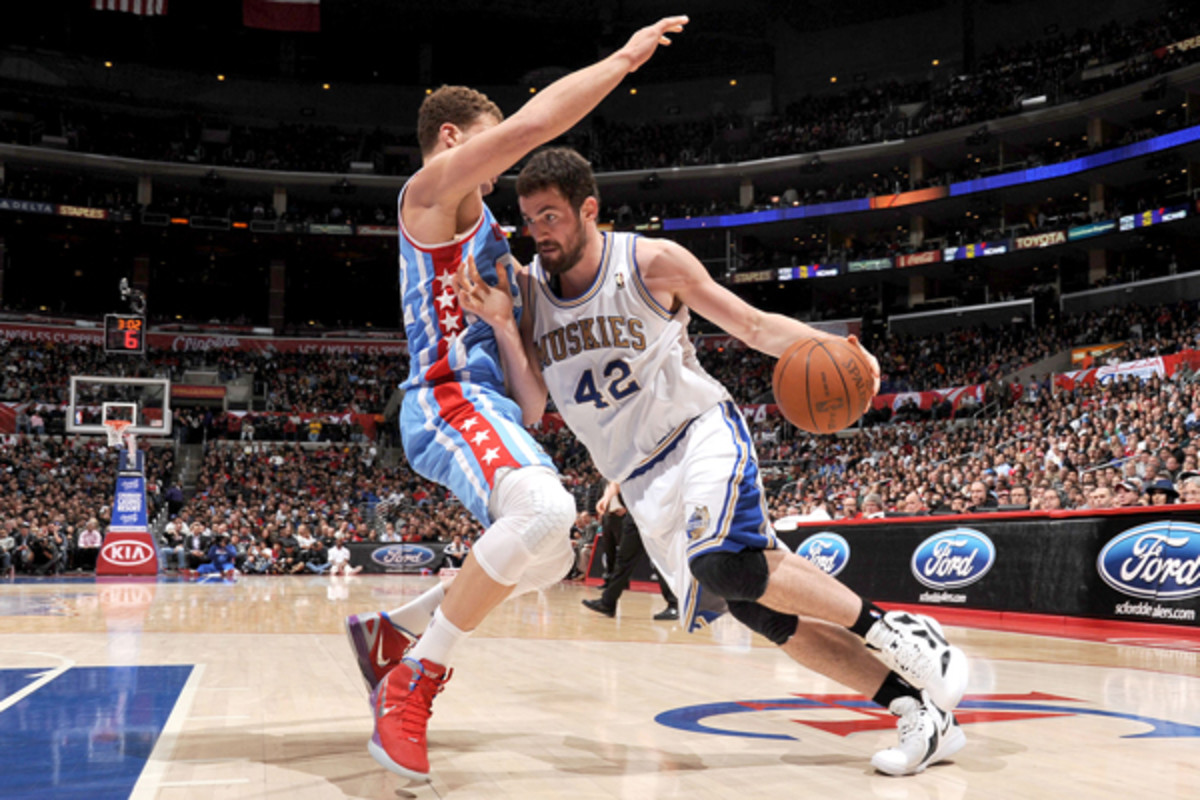 Kevin Love (right) led the Timberwolves by averaging 26 points and 13.3 rebounds in 2011-12.  (Noah Graham/Getty Images)