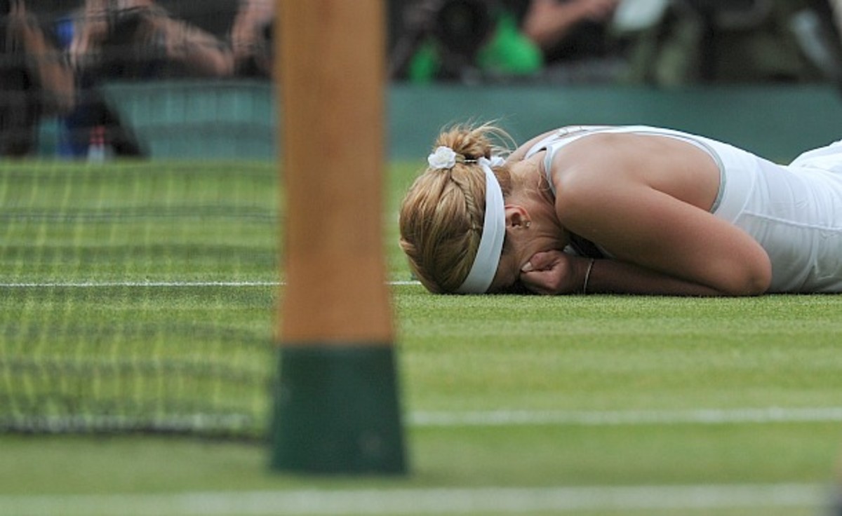 Sabine Lisicki collapses in tears after ousting No. 1 Serena Williams. (Carl Court/AFP/Getty Images)