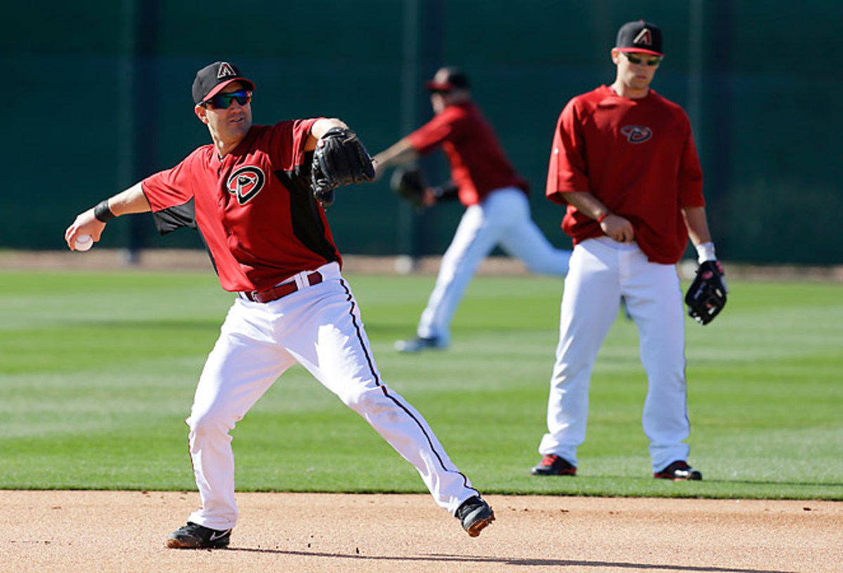 Willie Bloomquist throws during a spring training baseball workout with the Diamondbacks.