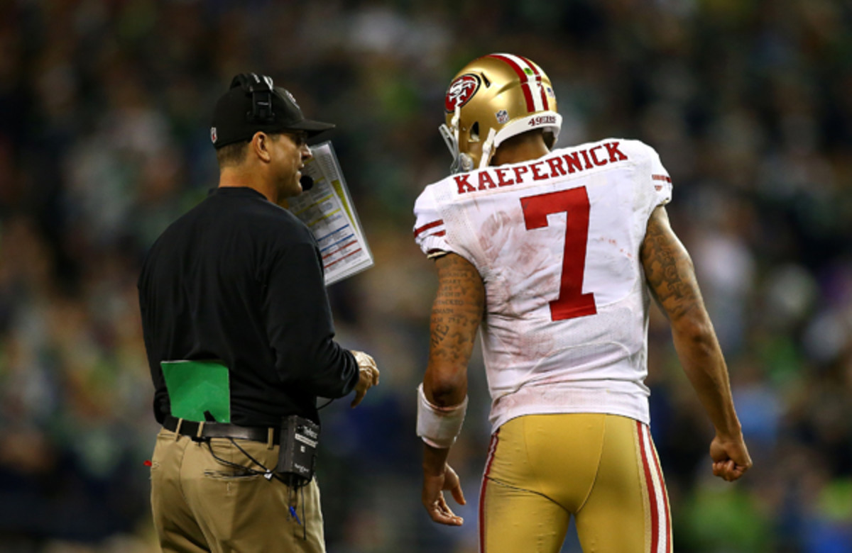 Jim Harbaugh and Colin kaepernick had few answers for Seattle's defense. (Getty Images/Jonathan Ferrey)