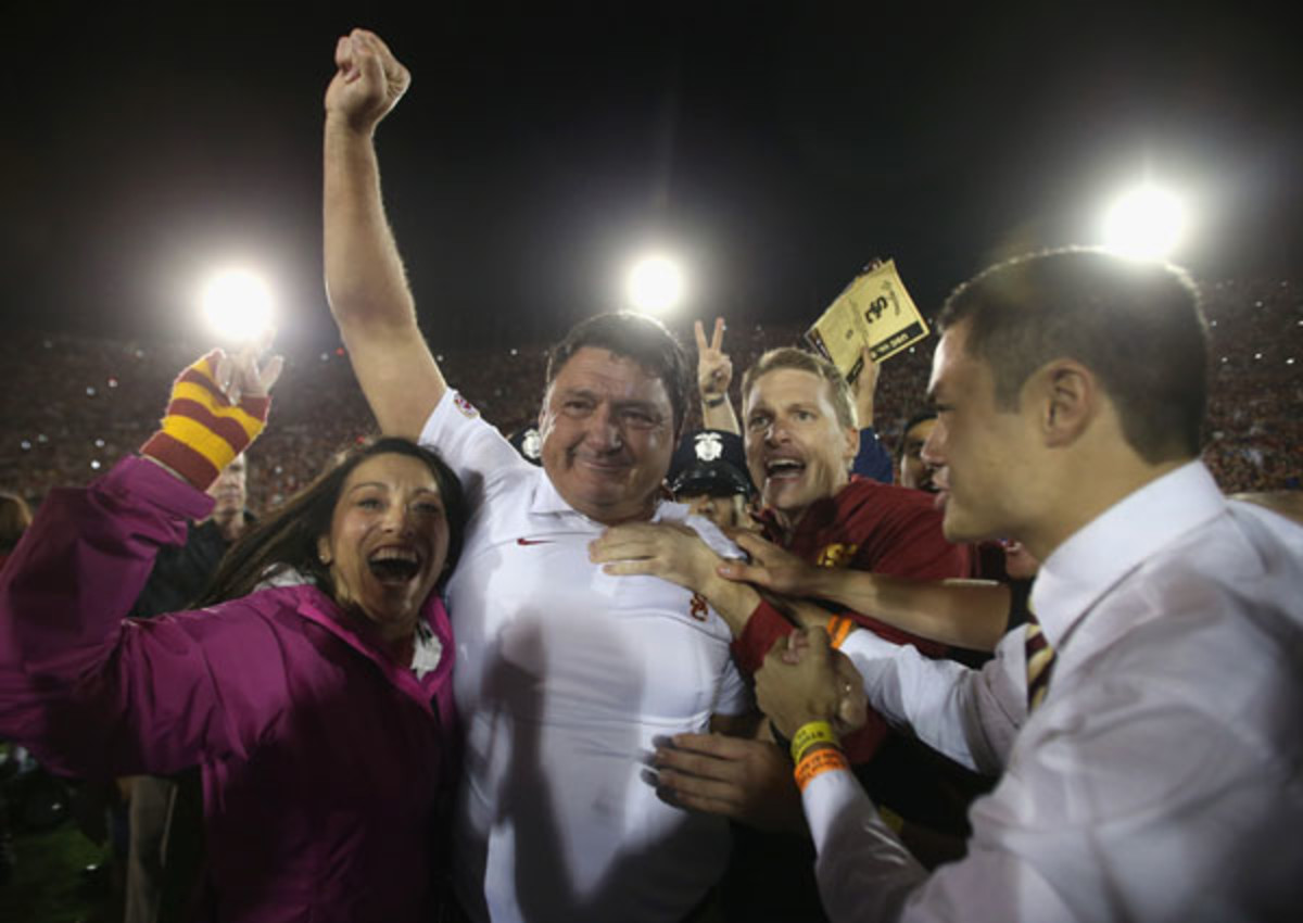 USC interim coach Ed Orgeron was mobbed by the crowd after beating Stanford on Saturday. (Jeff Gross/Getty Images)
