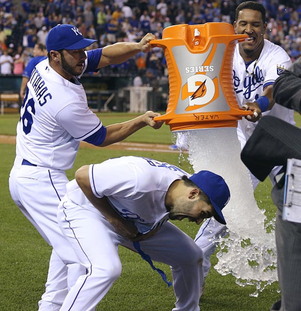 130610115833-eric-hosmer-avoiding-dousing-by-george-kottaras-salvador-perez-single-image-cut.jpg