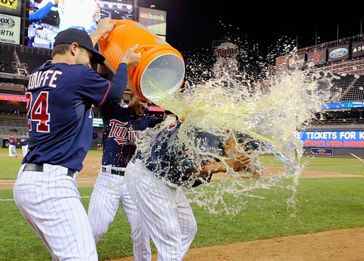 130610115806-aaron-hicks-doused-by-trevor-plouffe-eduardo-escobar-single-image-cut.jpg