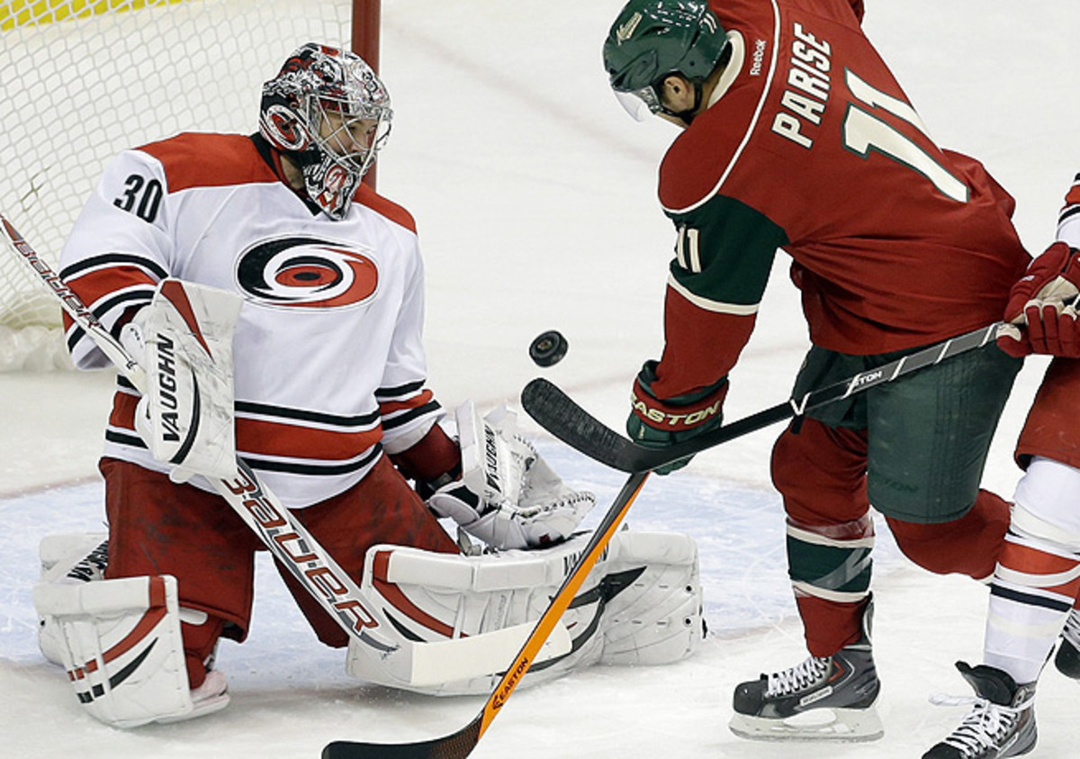 Cam Ward (left) was forced to exit Carolina's game against the Wild in Minnesota soon after it began.