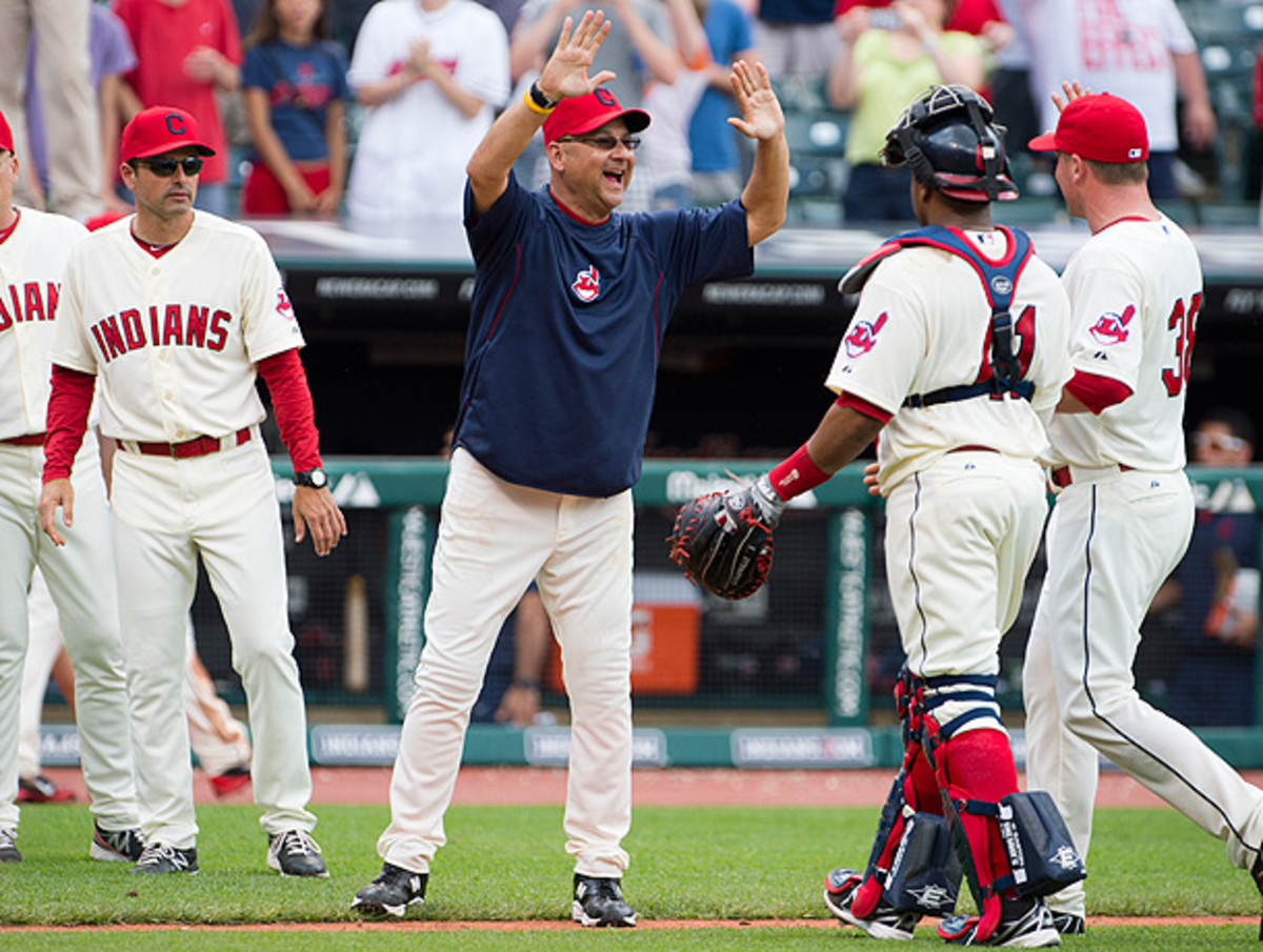 Terry Francona (center) guided the Indians to the playoffs in his first year as Cleveland manager. (Jason Miller/Getty Images)