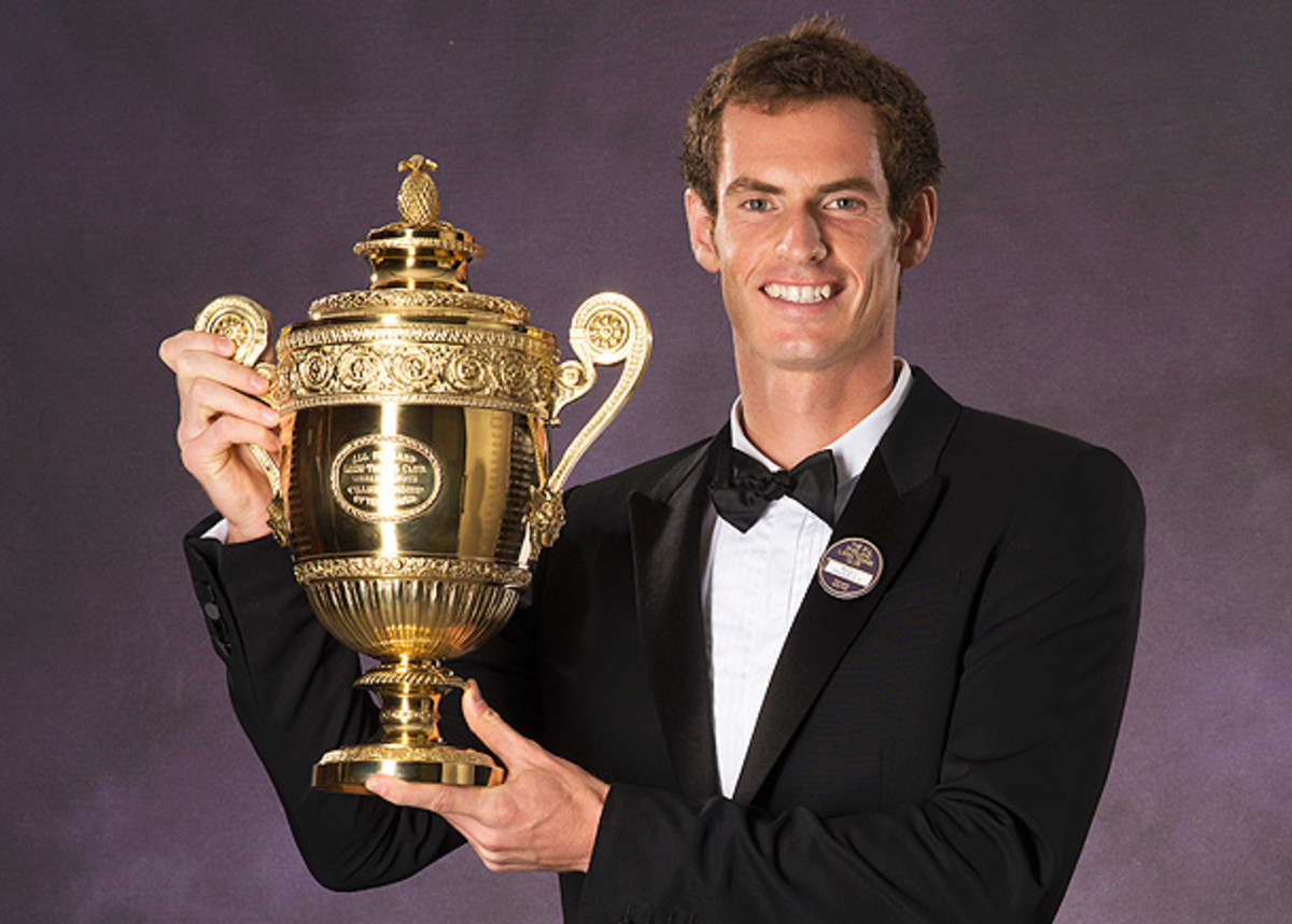 Andy Murray isn't the only one posing with his Wimbledon trophy. (AFP/Getty Images).