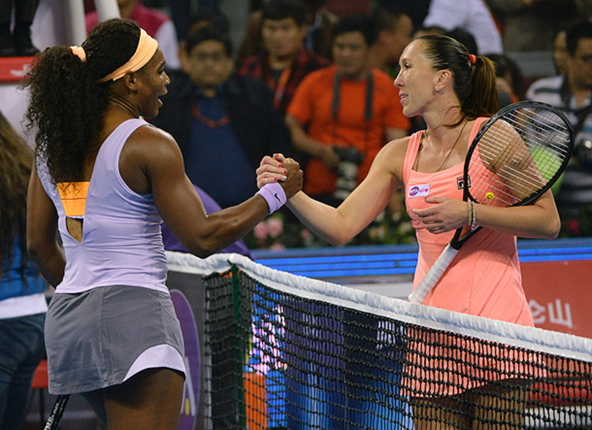 Jelena Jankovic and Serena Williams shake hands after squaring off in the China Open finals. (MARK RALSTON/AFP/Getty Images)