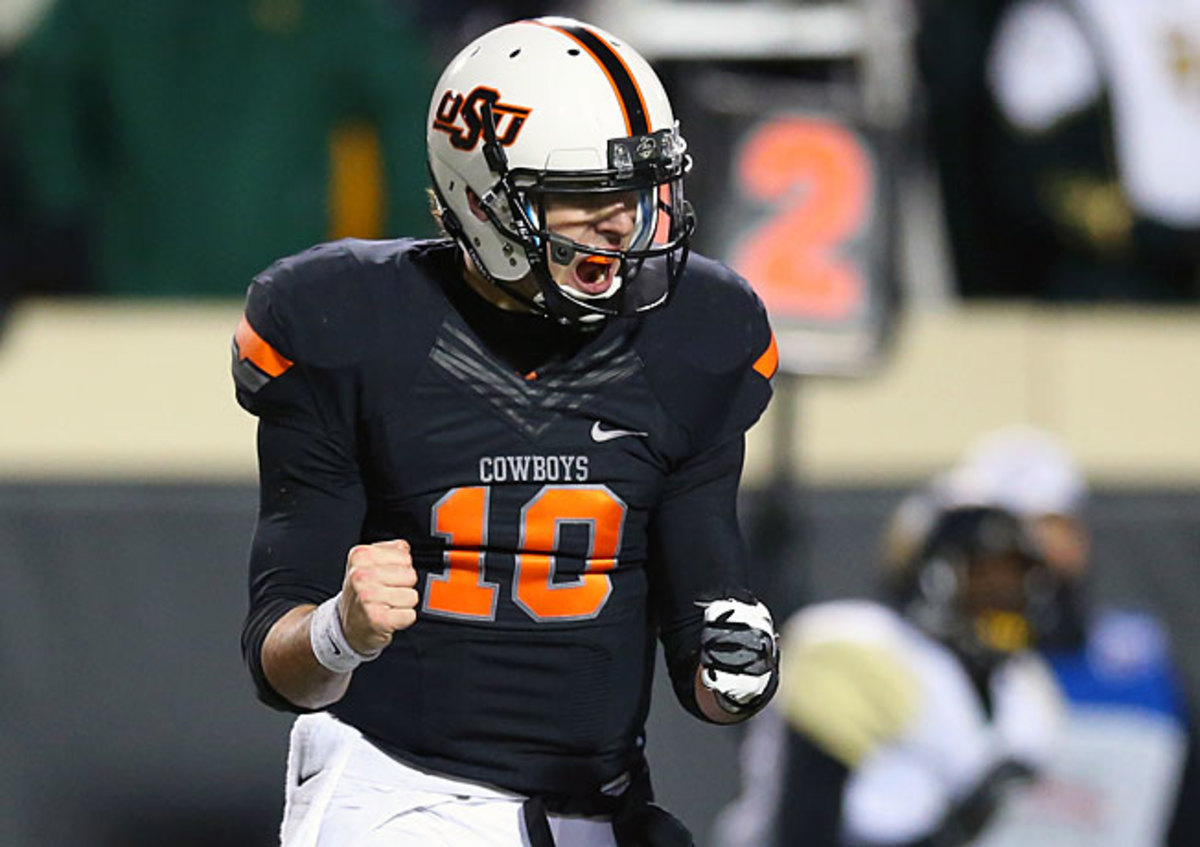 Oklahoma State QB Clint Chelf passed for a career-high 370 yards in the Cowboys' 49-17 rout of Baylor.