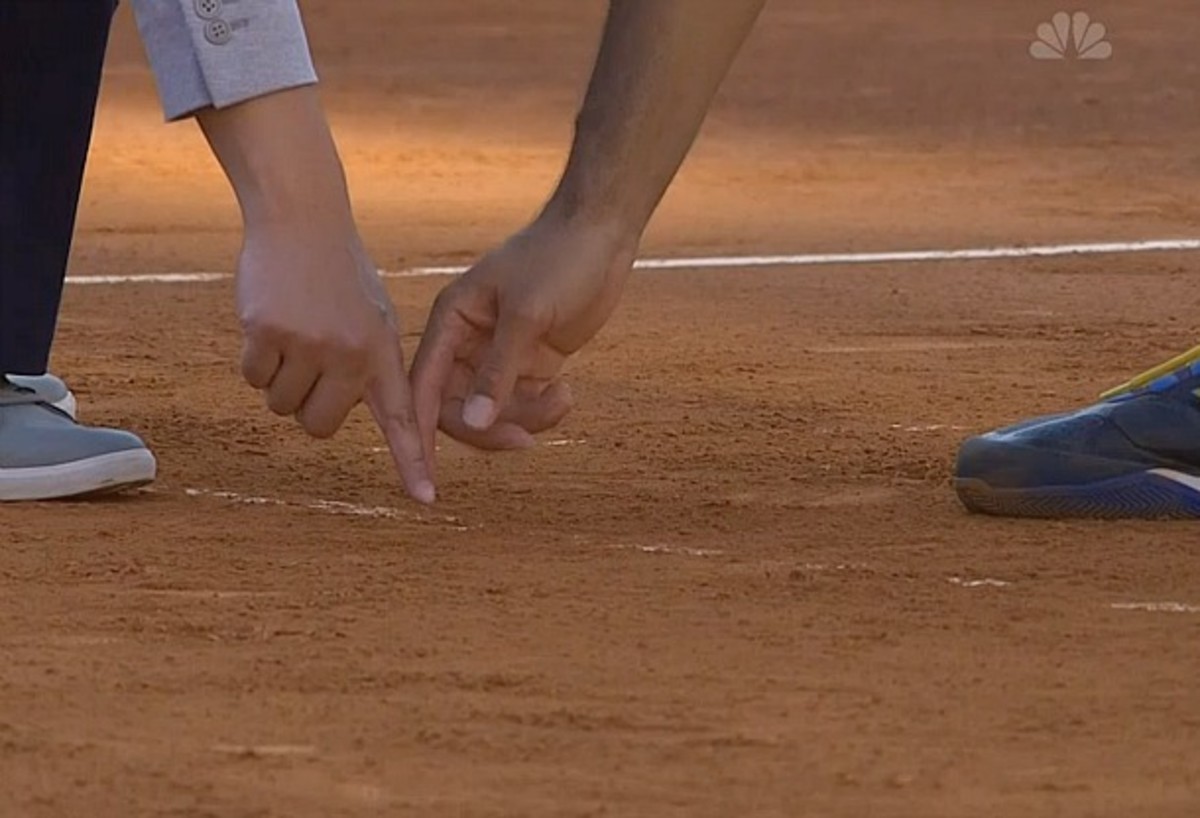 Tsonga disputes umpire James Keothavong's reading of a mark. (Screengrab from NBC.com)