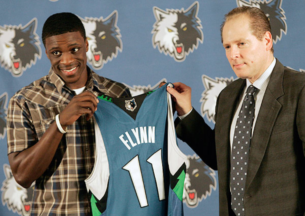 David Kahn (top) will reportedly be replaced by Flip Saunders. (Jim Mone/AP)