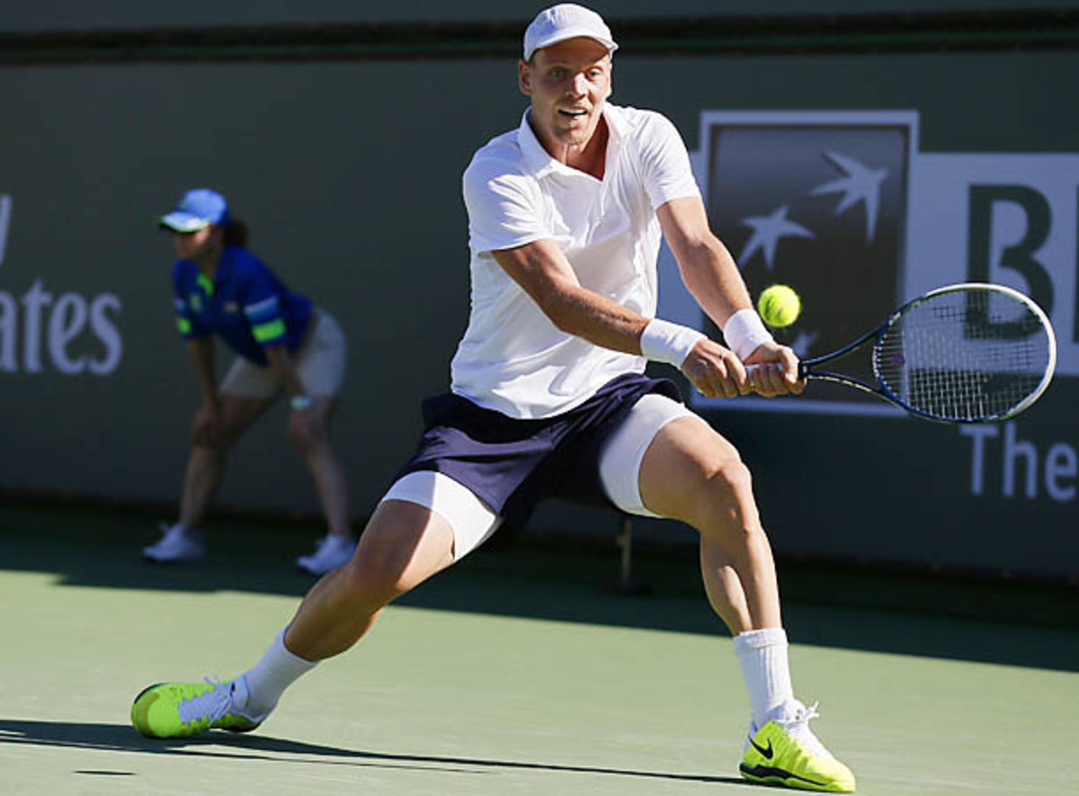 Tomas Berdych of the Czech Republic returns a shot against Florian Mayer of Germany at the BNP Paribas Open ATP tennis tournament in Indian Wells, California