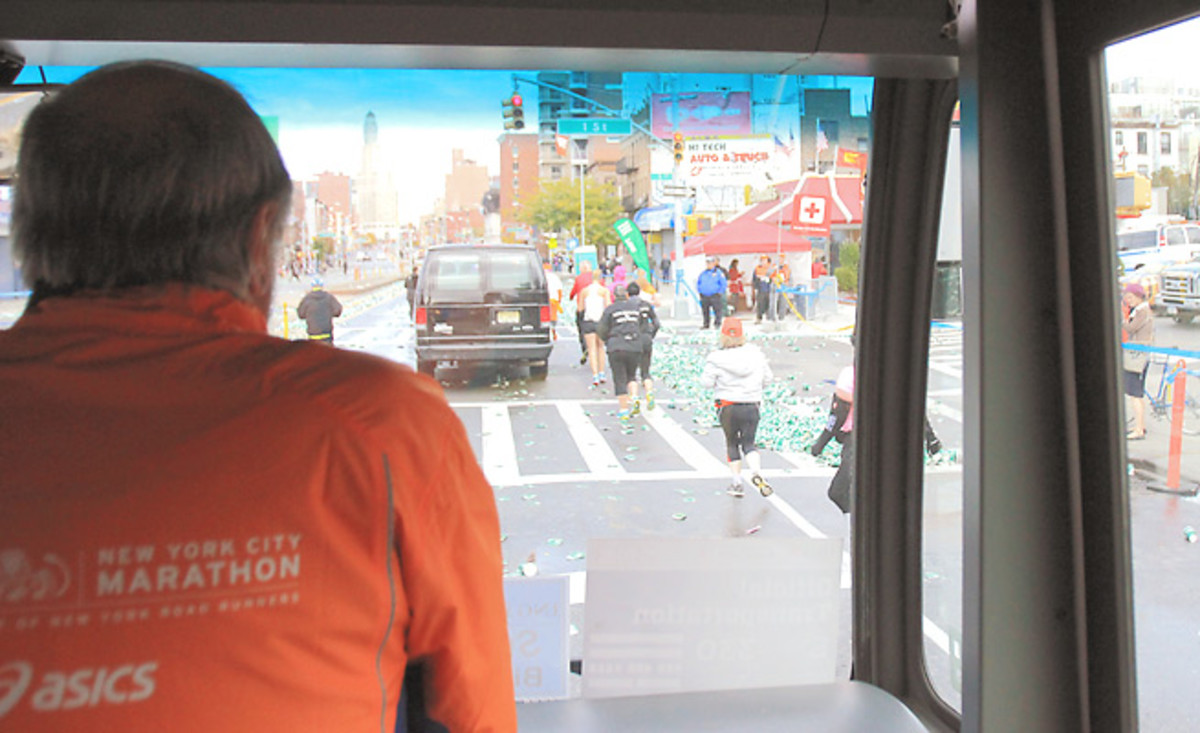 Volunteer Roger Bennorth rides the sweep bus, which picks up runners who can't finish the marathon.