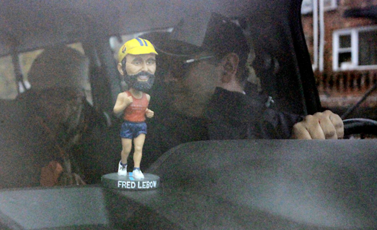 The spirit of Fred Lebow, founder of the New York City Marathon, continues to show in the custom bobblehead that rides in the sweep van and the thick beards many of the male volunteers grow.