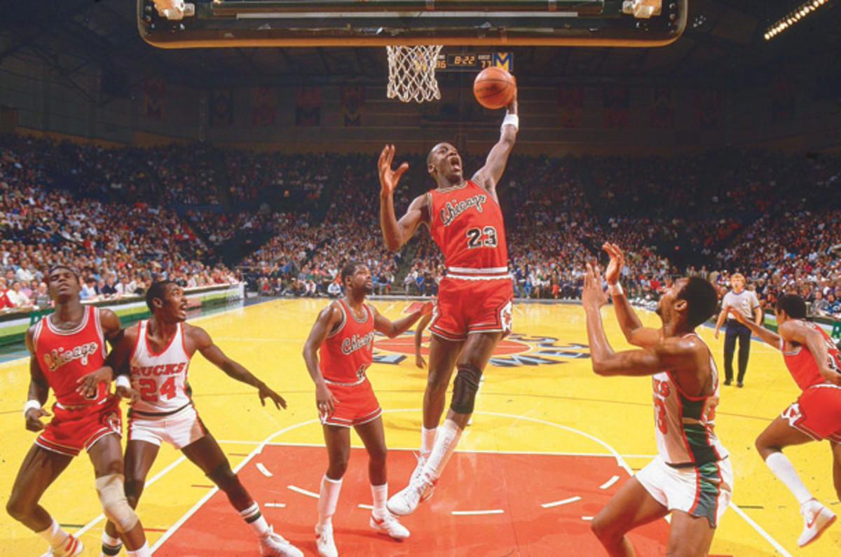 Jordan grabs a rebound during a game against Milwaukee. (Manny Millan/SI)