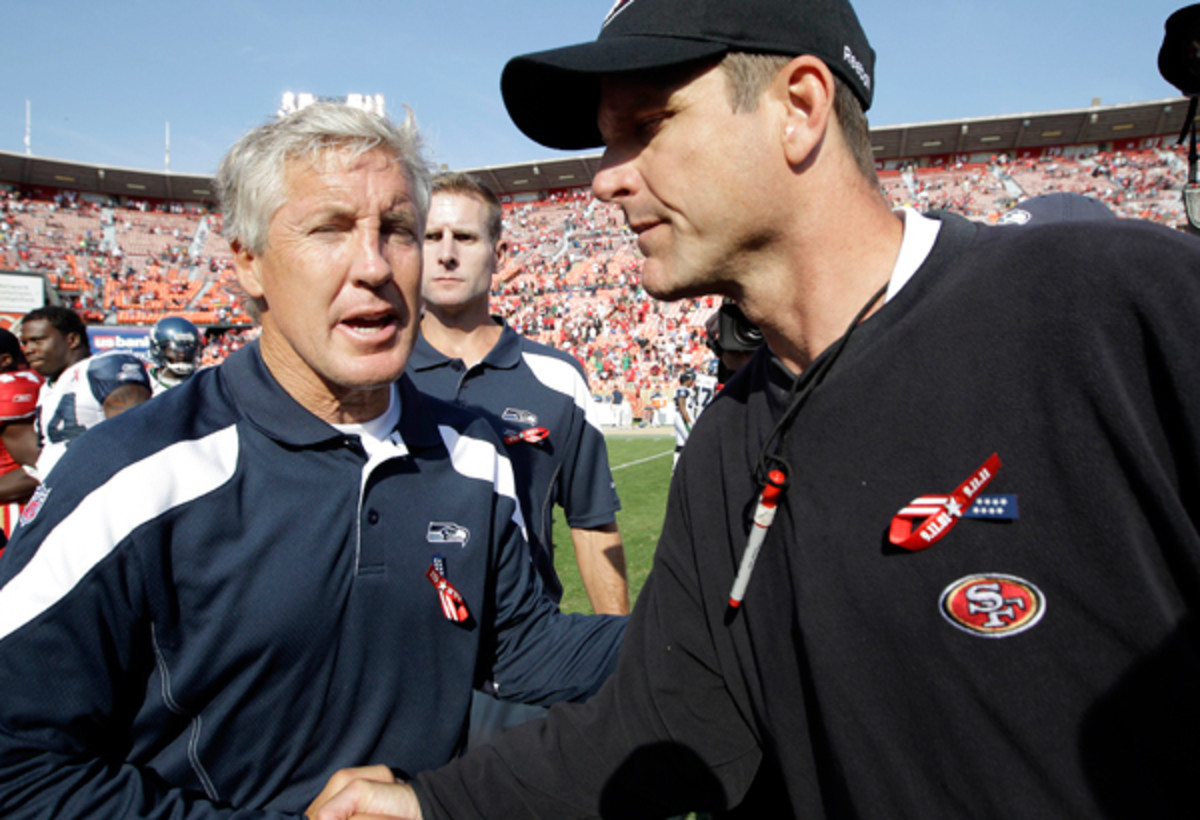 Pete Carroll and Jim Harbaugh, keeping it real in 2011. (AP/Paul Sakuma)